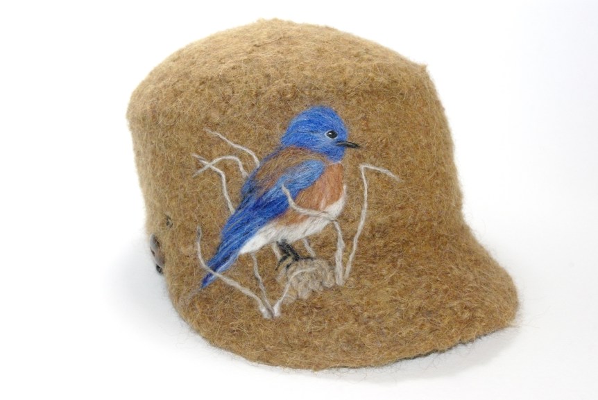 14-013 cap bluebird on rust pastaza llama wool sold to Gary Slater $80 for Eco Institute auction